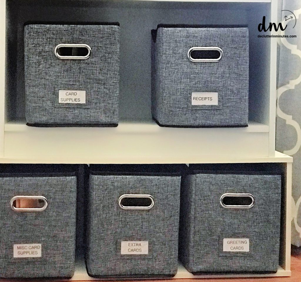gray baskets on a while shelf
