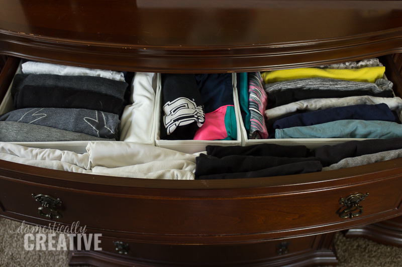 Image that shows collapsible bins to sort seasonal clothes.