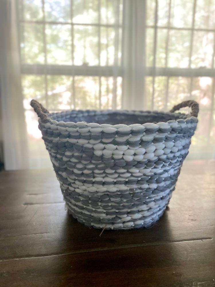 a Dollar Tree basket turned into a rope basket. 
