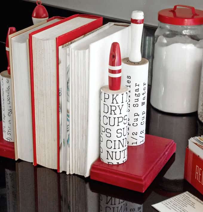 a DIY rolling pin book end that hold recipe books.