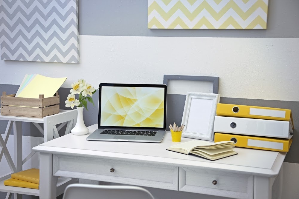Stylish workplace with laptop at home