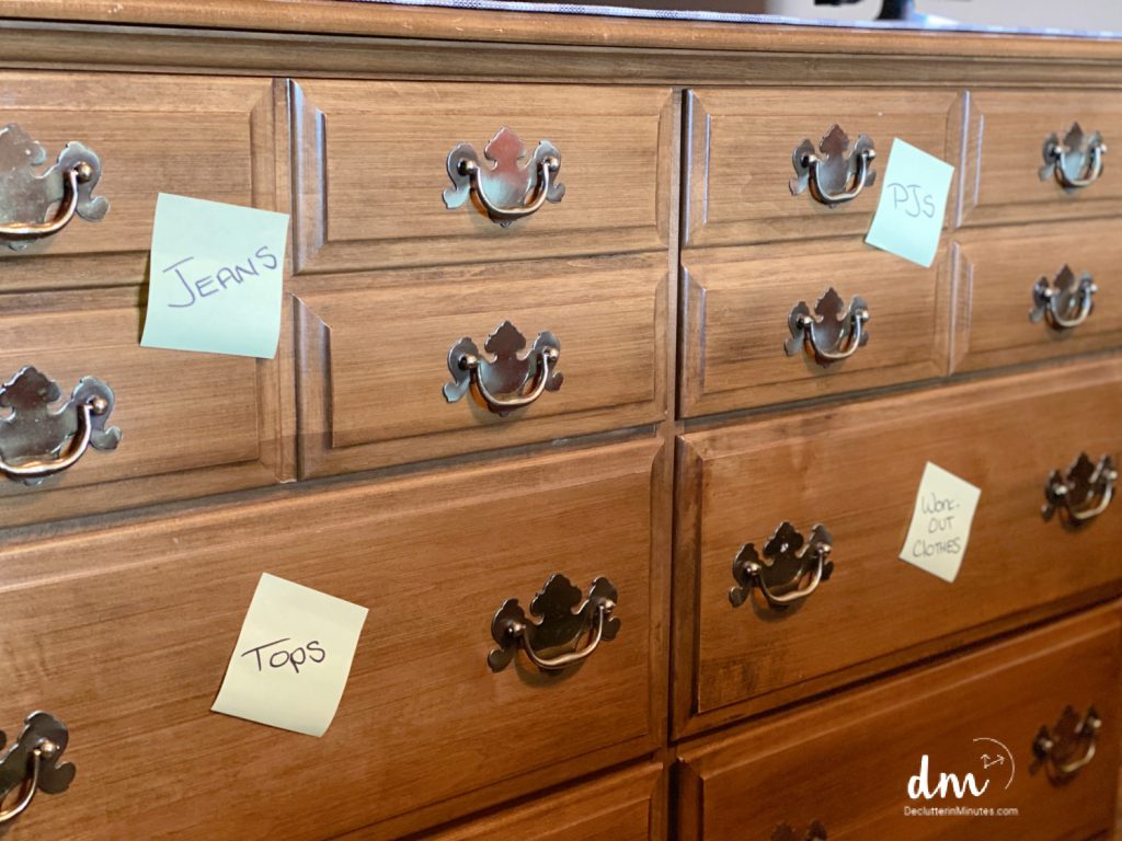 yellow sticky note labels on a dresser