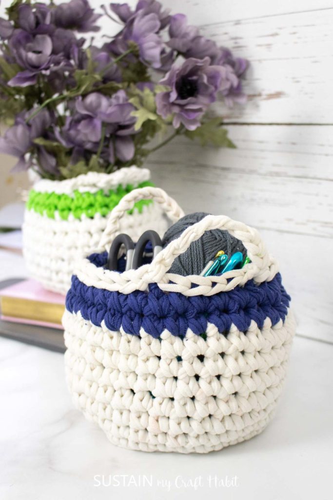 an old t-shirt used to crochet a basket with scissors and yarn in it