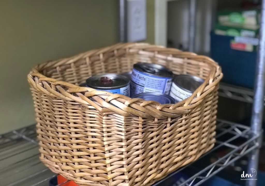 a wicker basket that holds canned goods