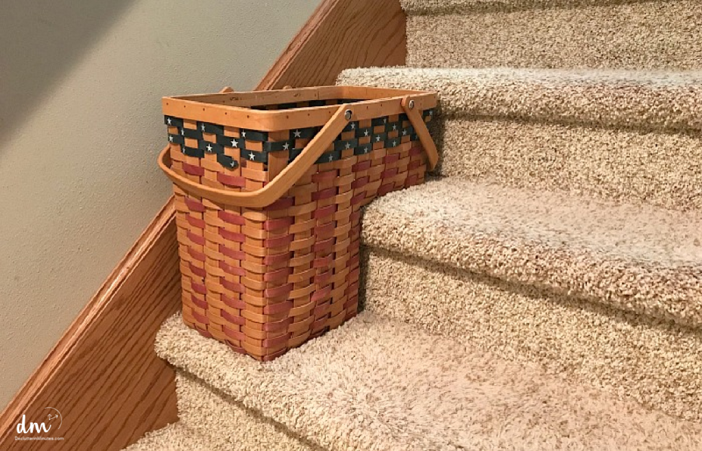 a woven basket that sits on the stairs