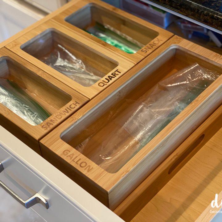 wooden organizer in a drawer holding plastic storage bags