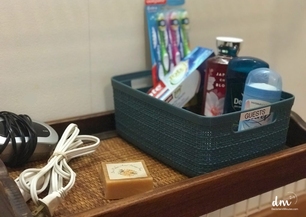 a basket in a guest bedroom with toiletries inside