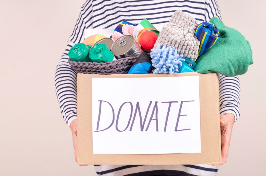 a box of pet supplies in a donation box
