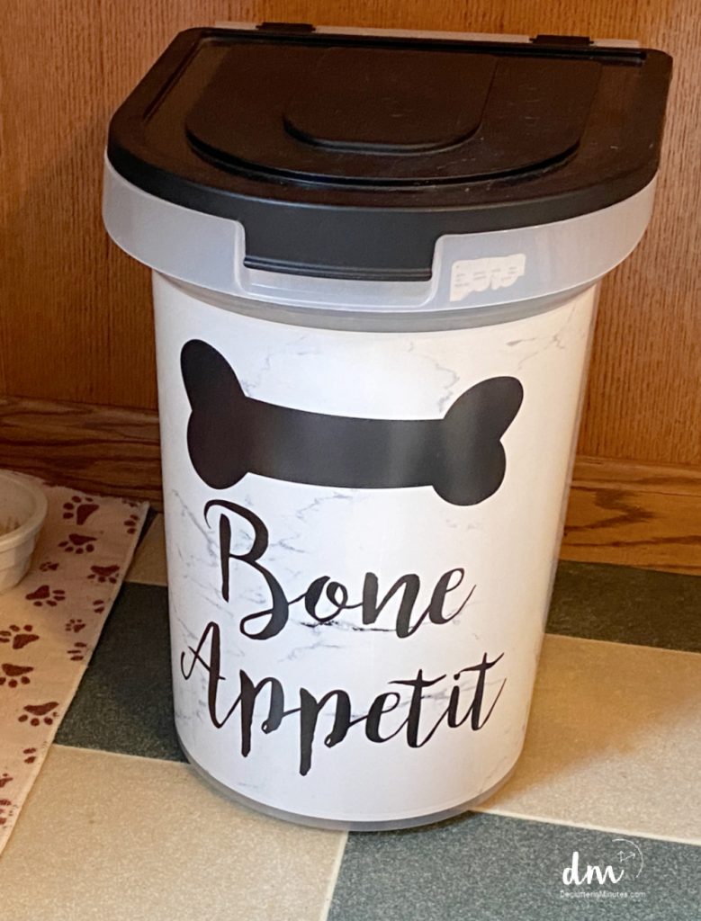 a plastic container of dog food in a kitchen