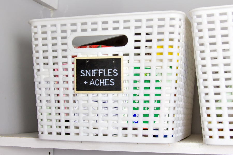 An image that shows labeled plastic bins for sniffles. 