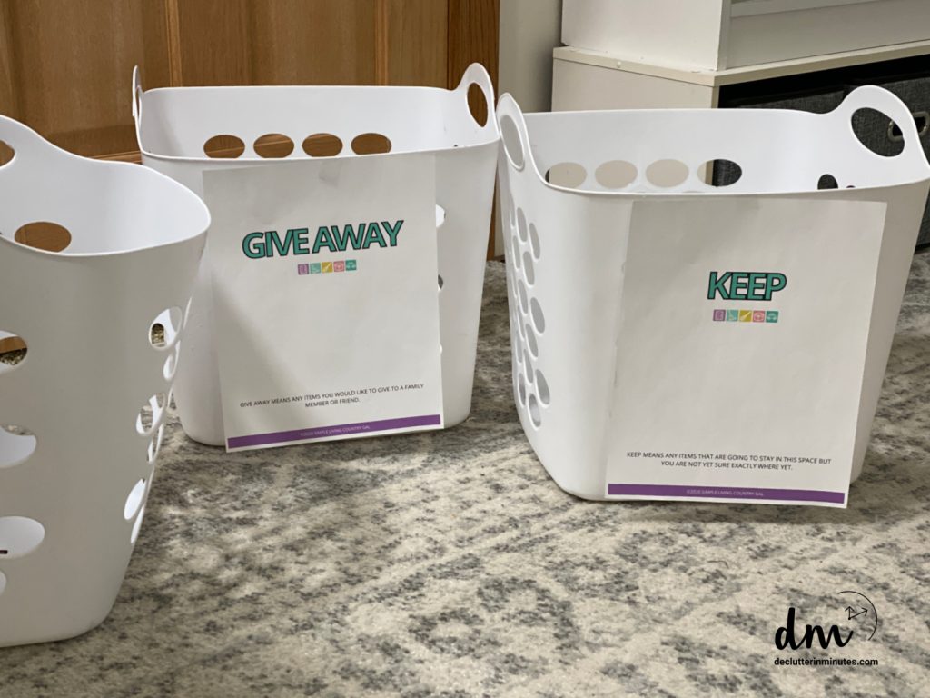 white laundry baskets labeled keep and give away