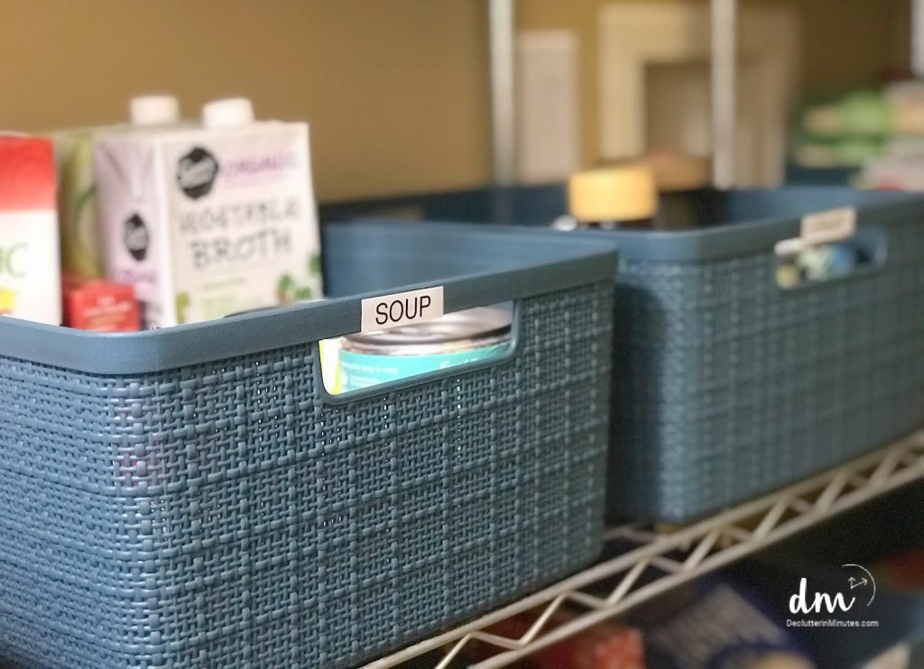 2 blue baskets on a wire rack pantry shelf