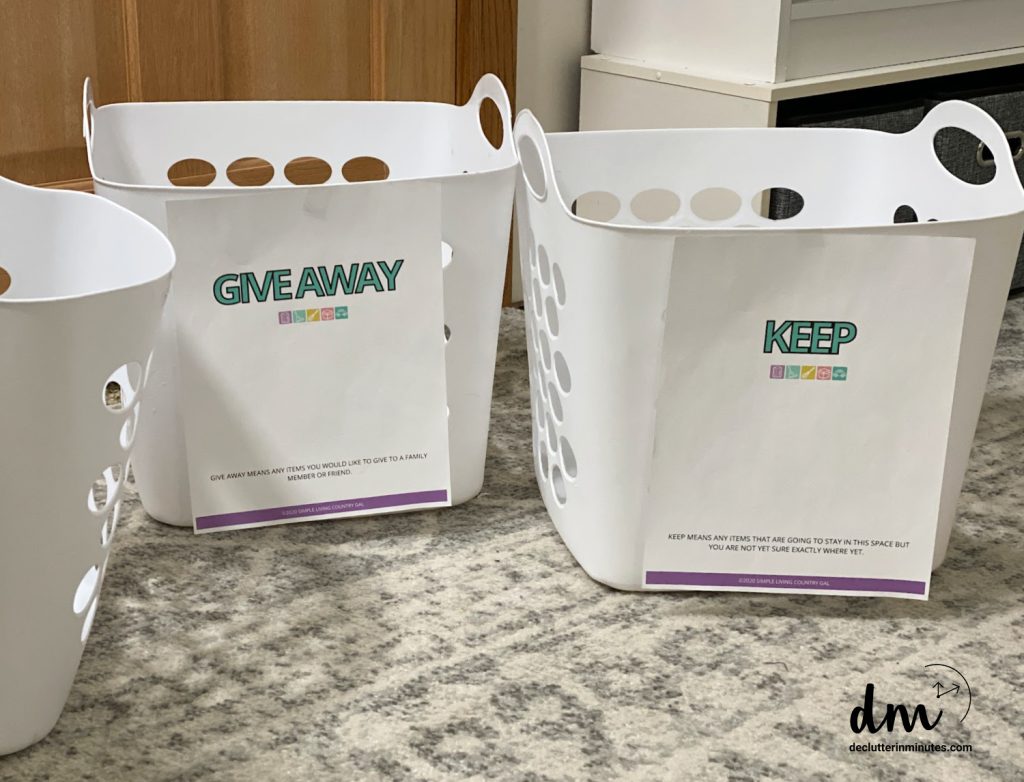 white laundry baskets labeled keep and give away copy