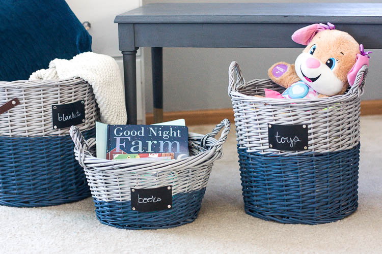 Image that shows painted wicker baskets that store stuff animals and books. 