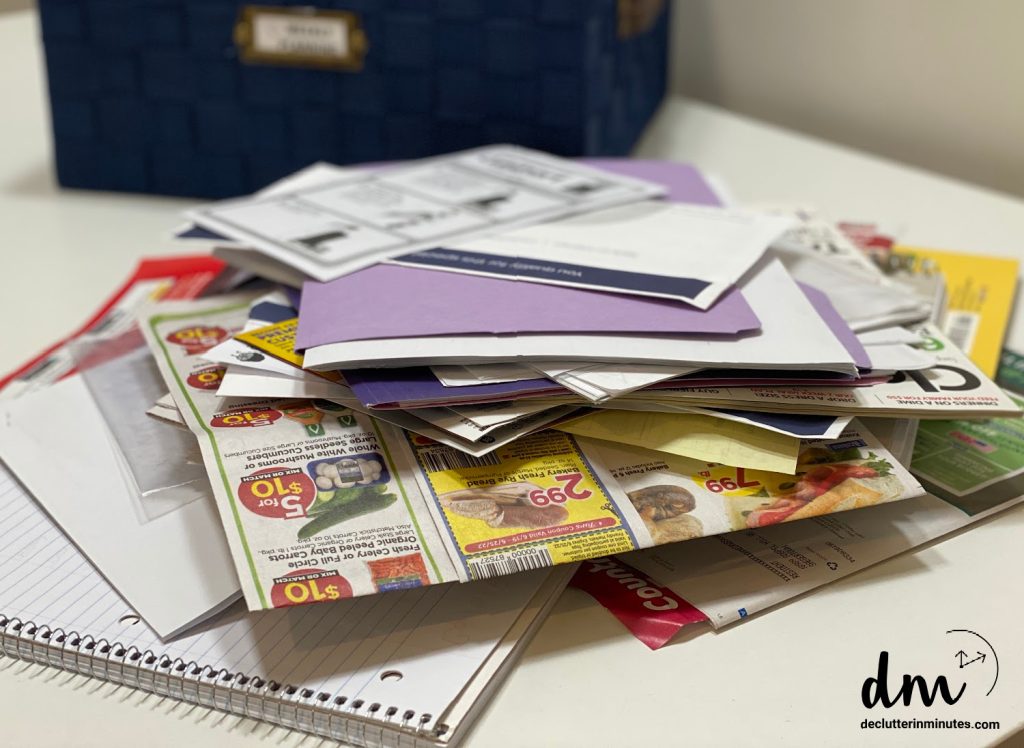 a pile of random papers in a messy home office