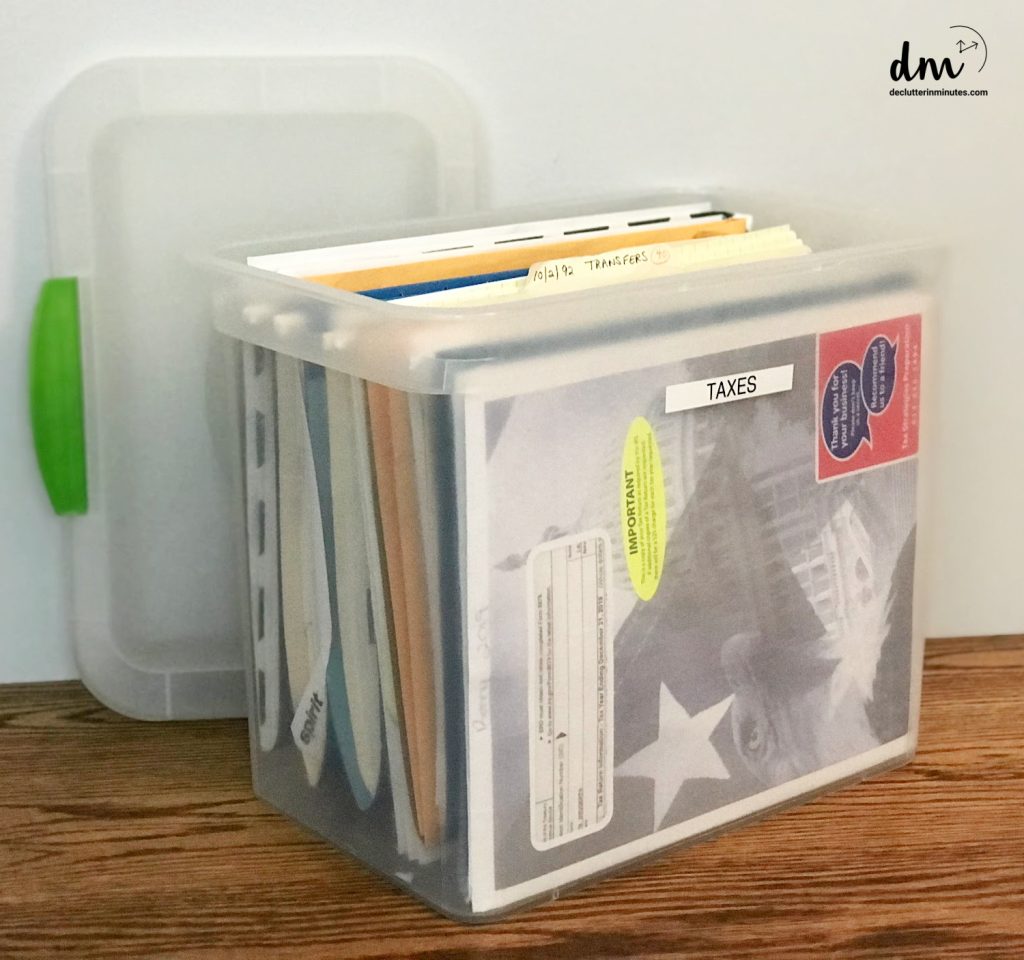 a plastic file tote labeled taxes on the front copy