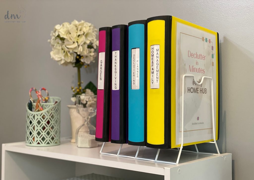 colorful binders in a metal file folder
