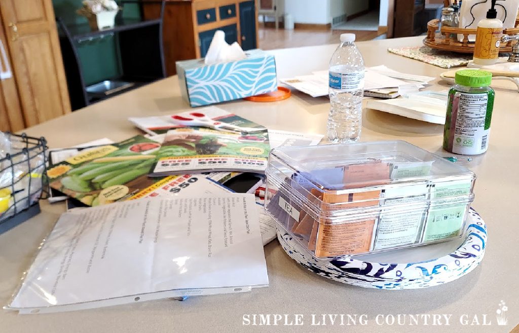a messy kitchen counter with a to-do list buried under papers
