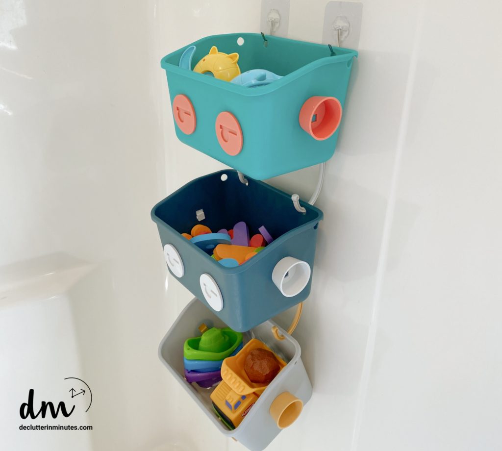 plastic bins of toys in a shower