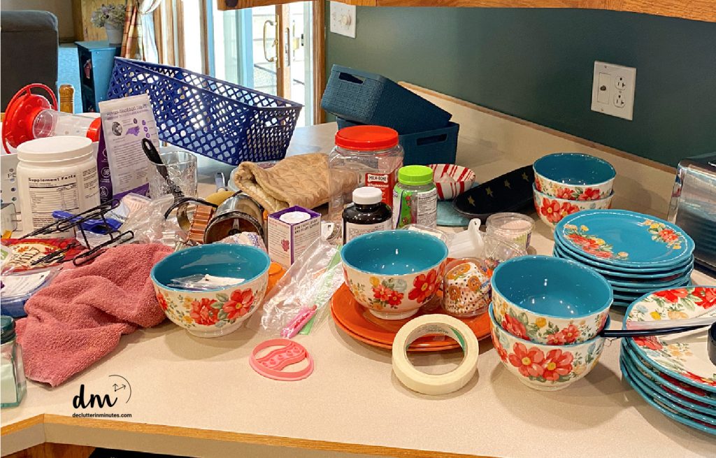 random dishes and stuff lying out on a kitchen counter