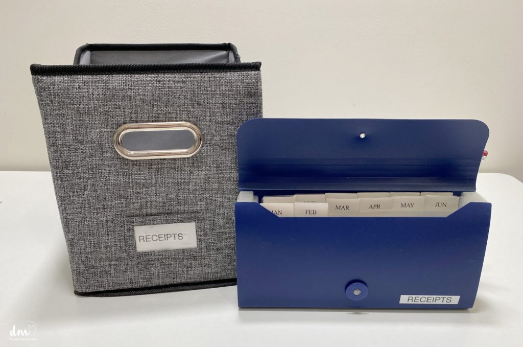 a basket and accordian file labeled receipts on the front