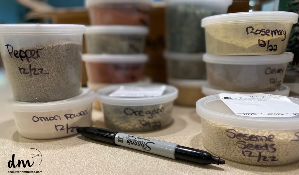 a stack of spices with a marker in the front on a counter