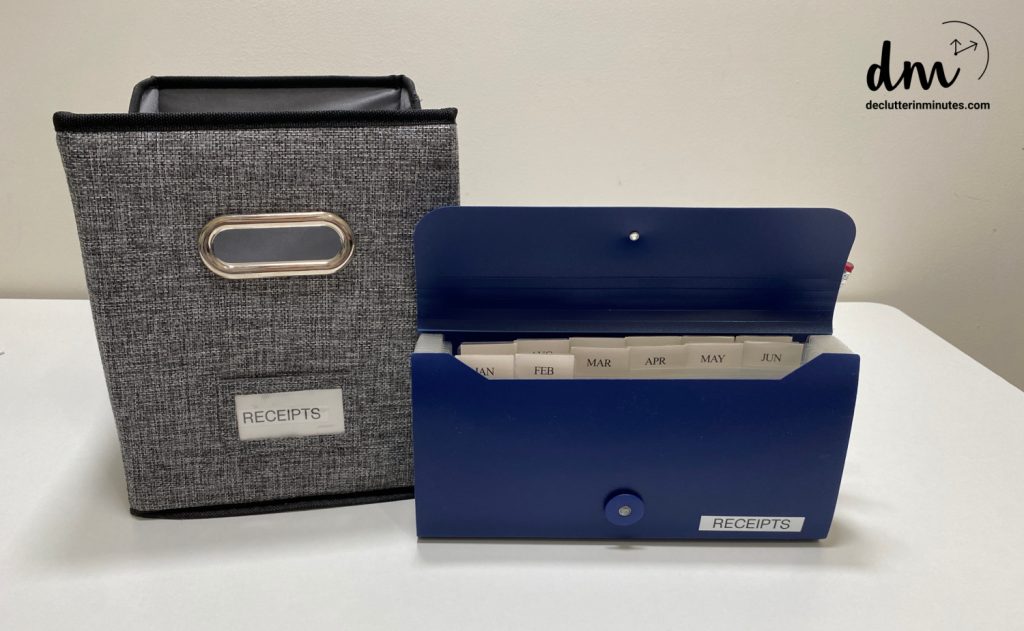 a blue accordion file next to a grew canvas bin both labeled receipts