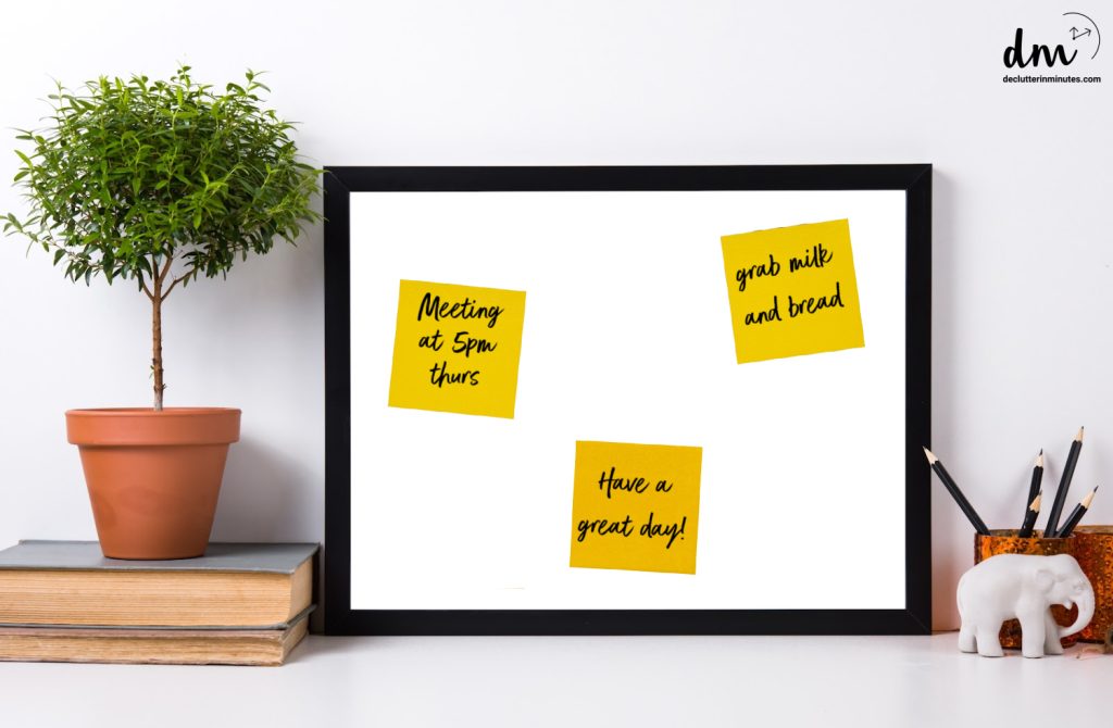 a photo frame with post it notes on the front with messages.