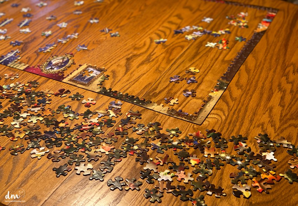 a puzzle spread out on a brown table