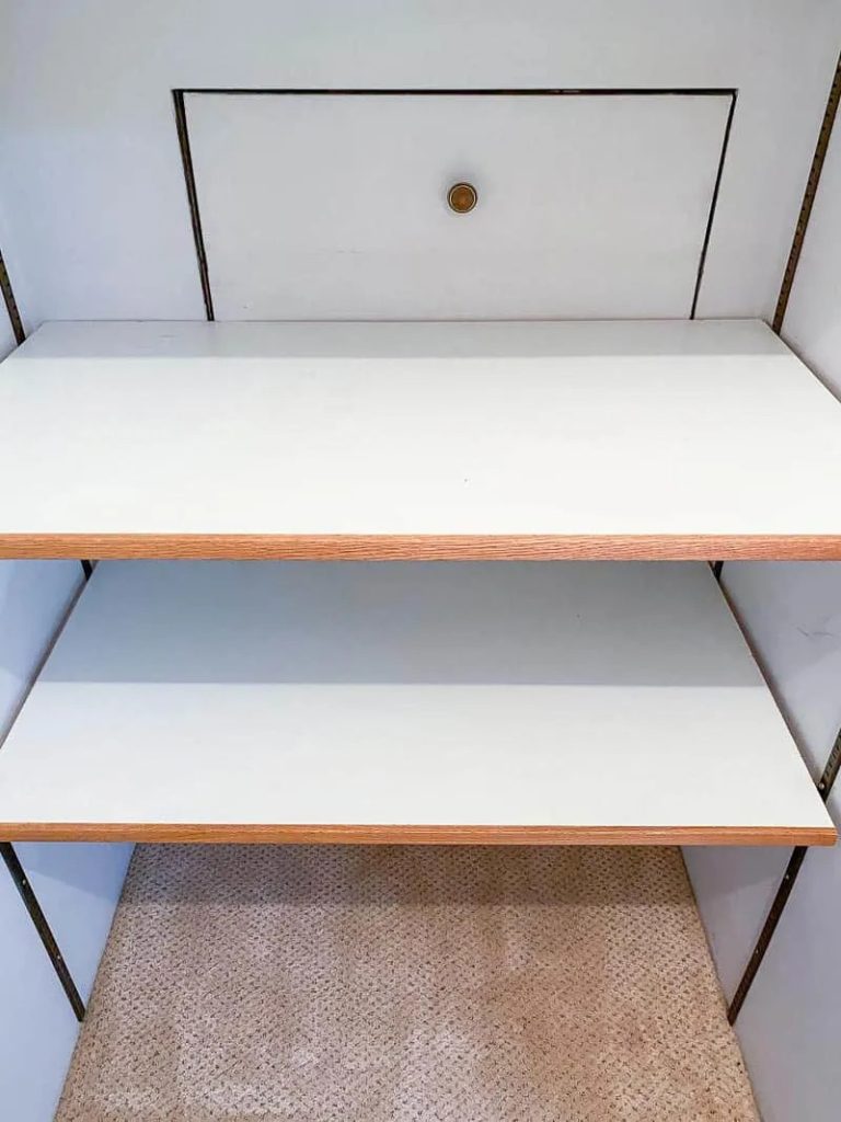 wooden shelves built into a closet. 