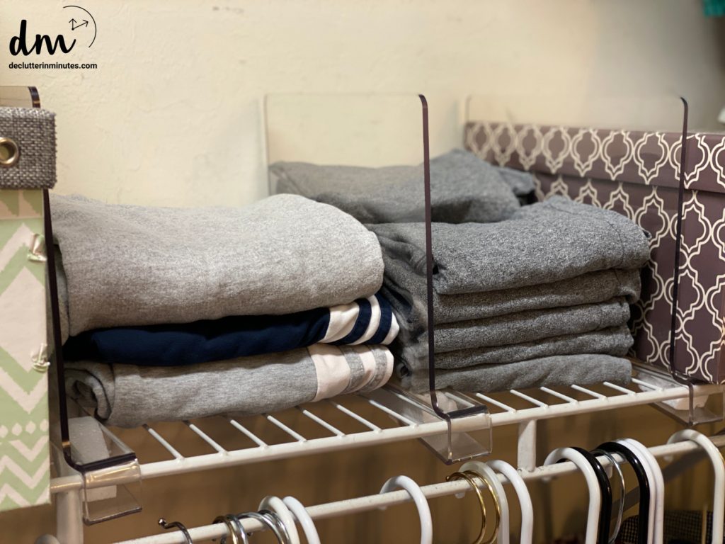 plastic dividers and folded clothes