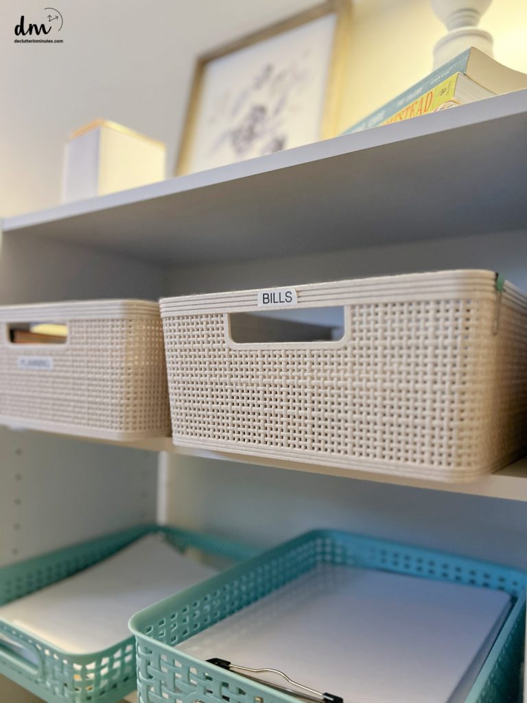 a basket labeled bills on a shelf in a home office
