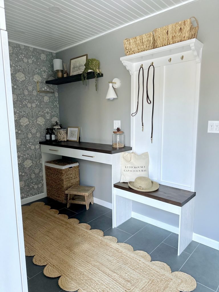 laundry room with storage boxes and cabinets
