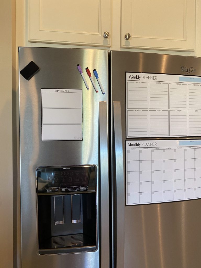magnetic organizers on a refrigerator command center 