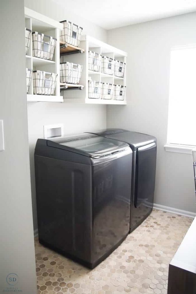 washing machine and raised storage solutions in a laundry room