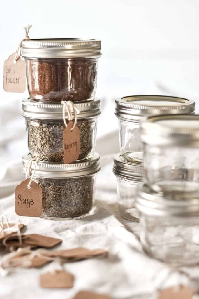 spices in mason jars with handwritten labels
