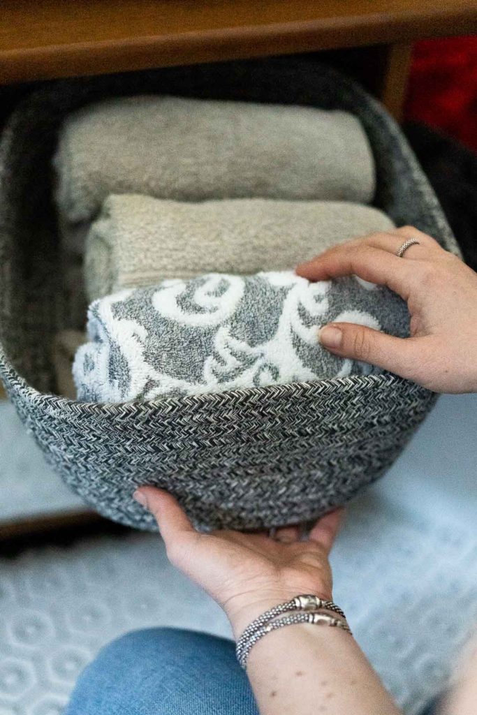 towels and blankets in storage bins