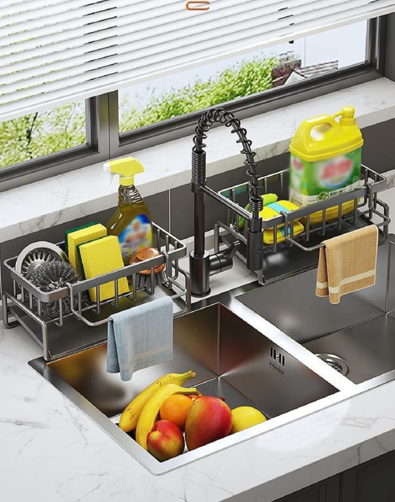 a metal organizer sitting on a kitchen sink