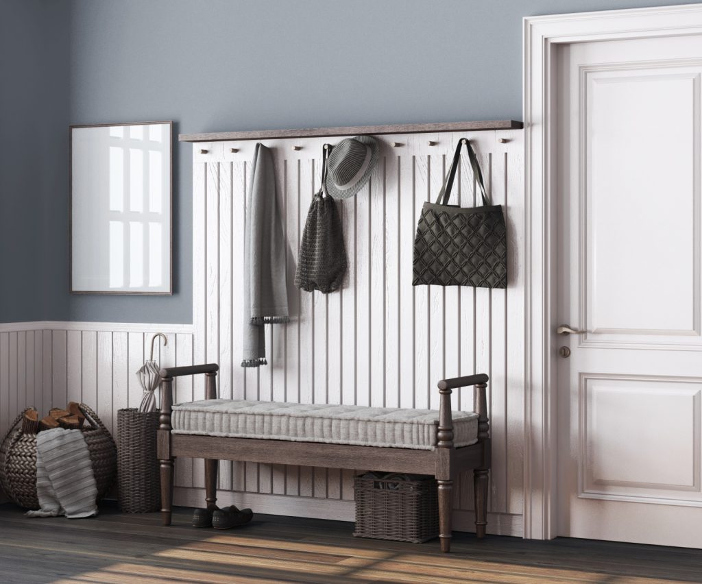 hooks and a bench in a mudroom
