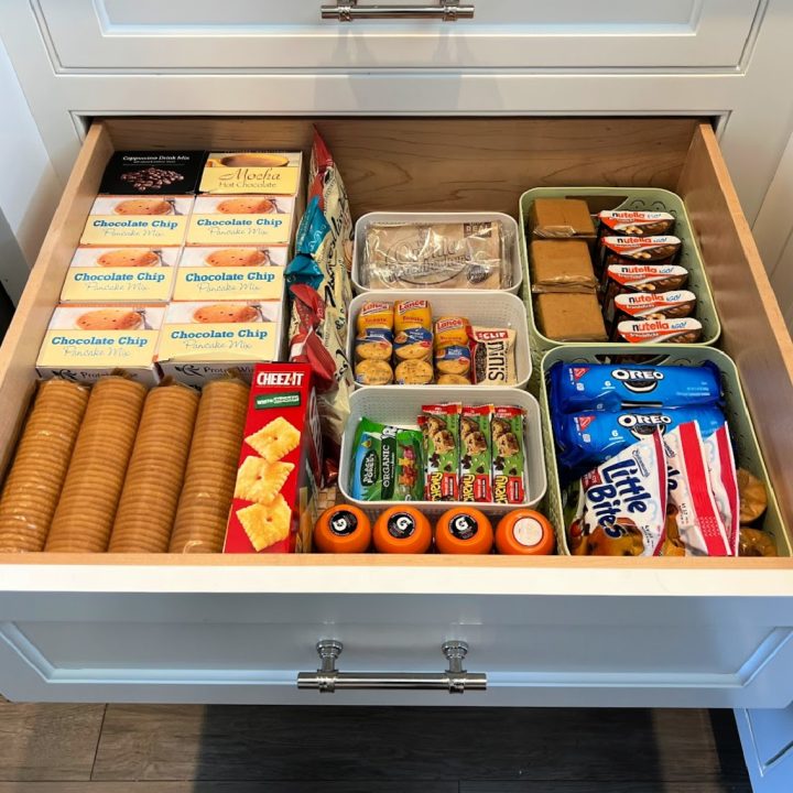 Snack drawer filled with things to eat in an organized pantry