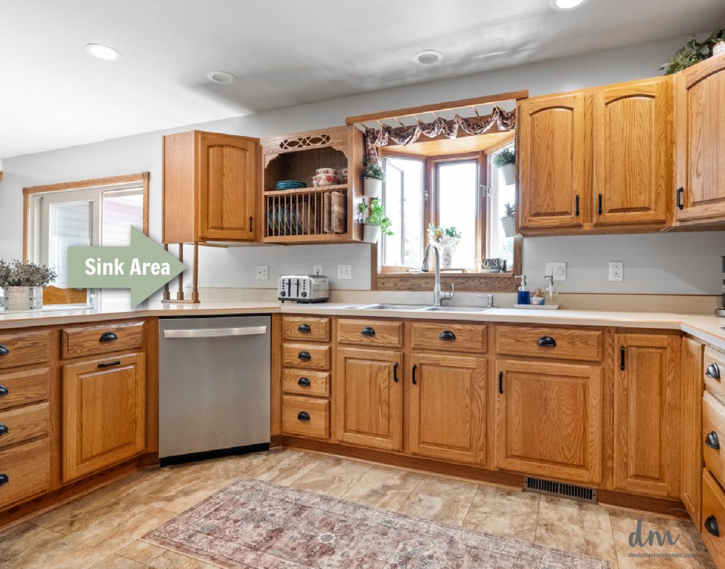 A sink and dishwasher in a kitchen layout with a green arrow and the words_ Sink Area