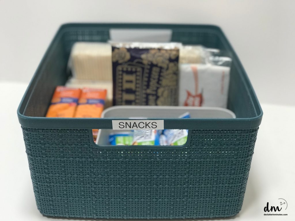 a blue basket of snacks