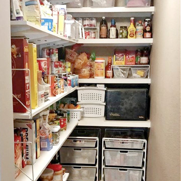 a skinny and small kitchen pantry that is neat and organized