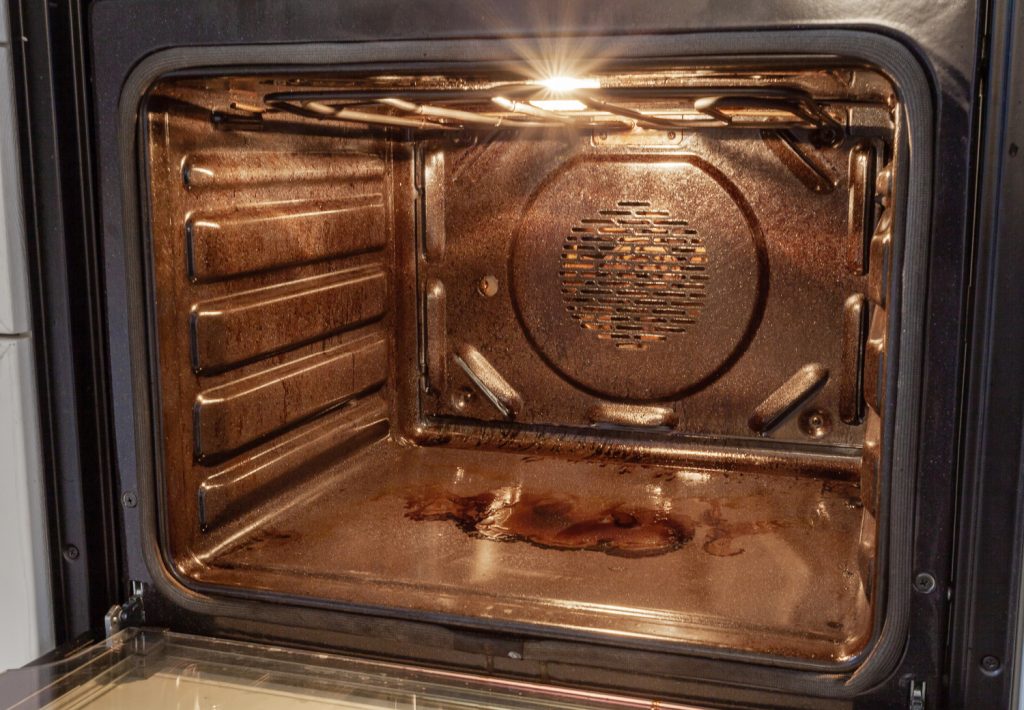 the inside of a dirty oven