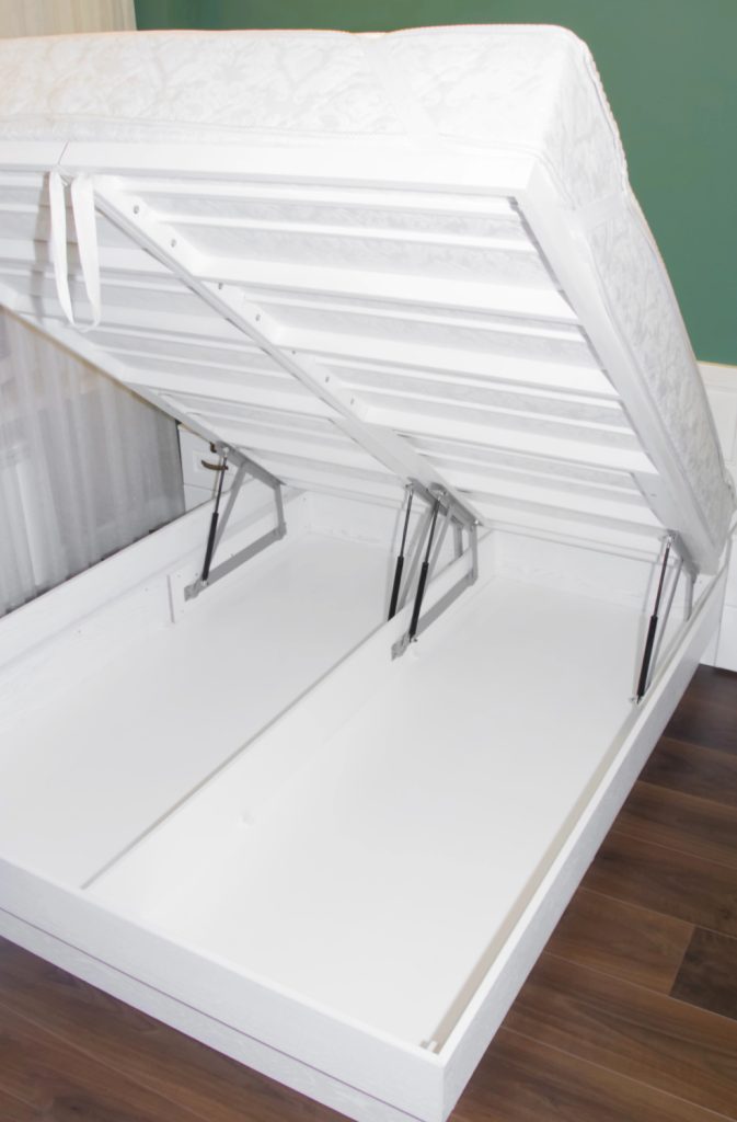 bed lifted up to show storage underneath