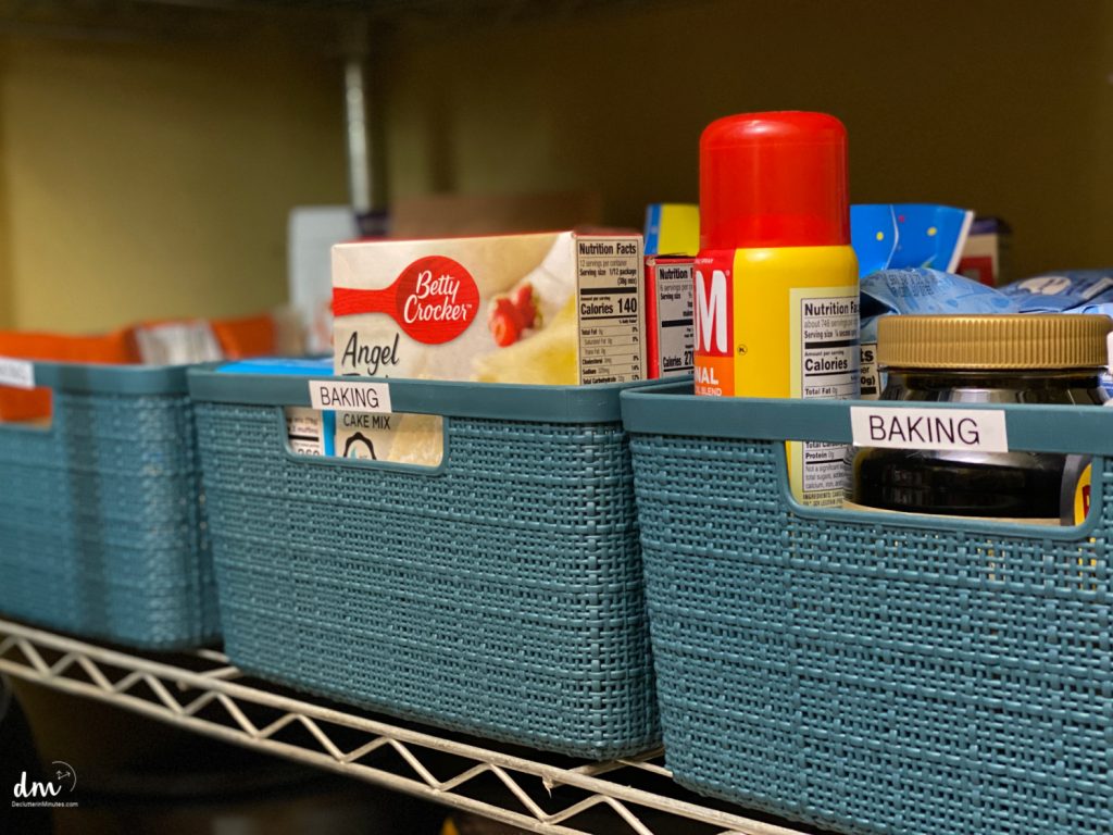 baking supplies in blue baskets in a pantry