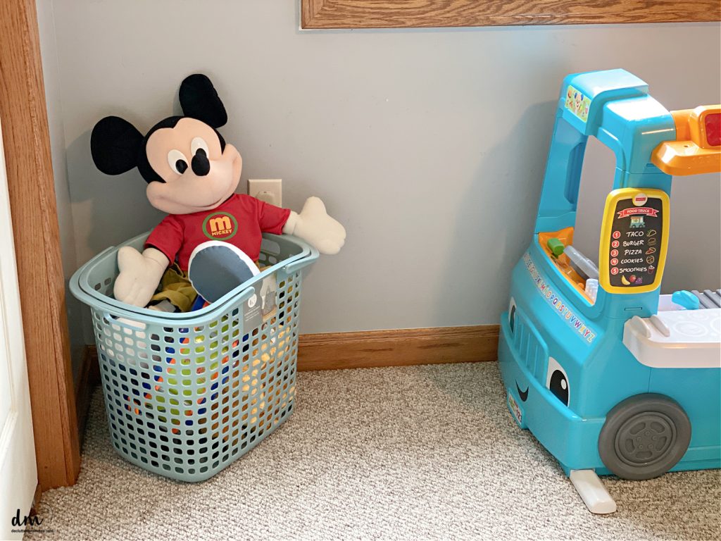 a basket of toys in a child's bedroom