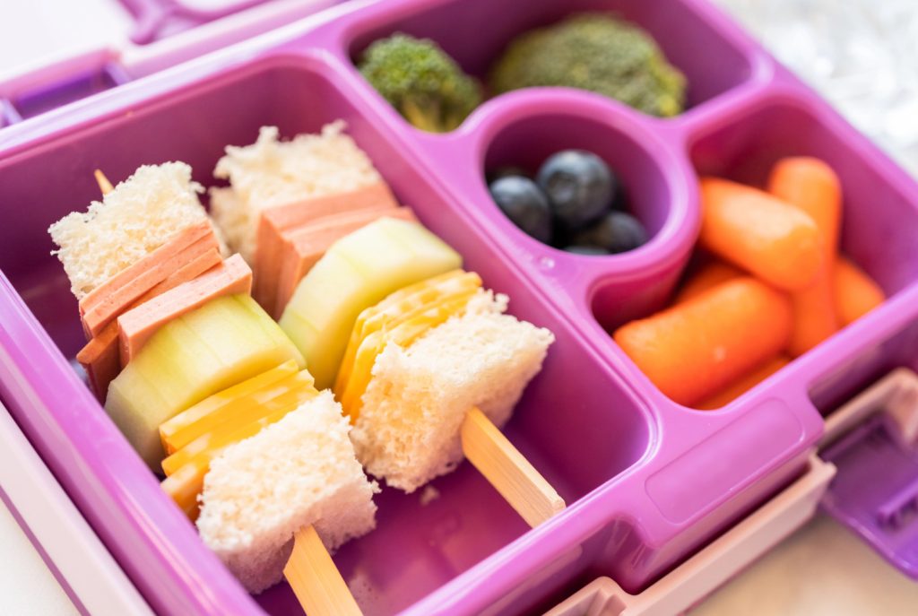 a pink container of kid friendly snacks