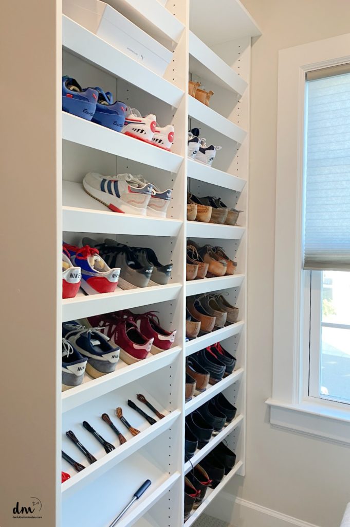 shoes on a shelf in a white closet