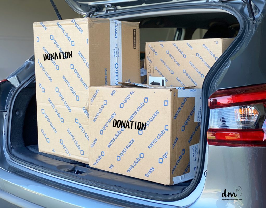 a car fill with donation boxes